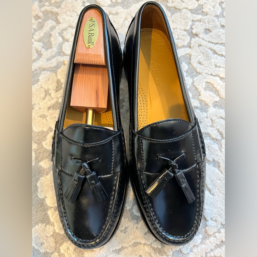 Brand new Cole Haan black leather pinch tassel
